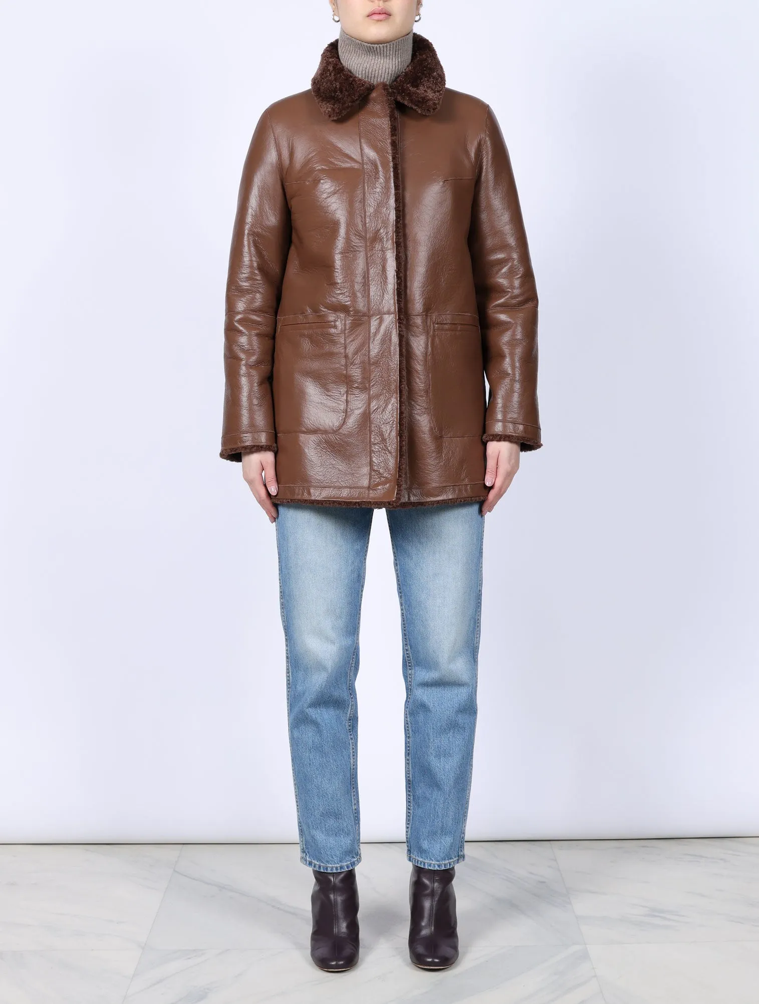 The Stasia Reversible Patent Shearling Jacket in Olive